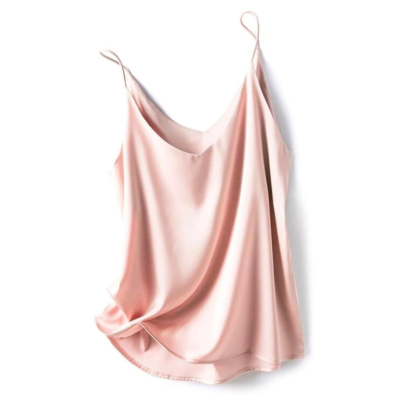 Women's pink silky camisole top displayed flat