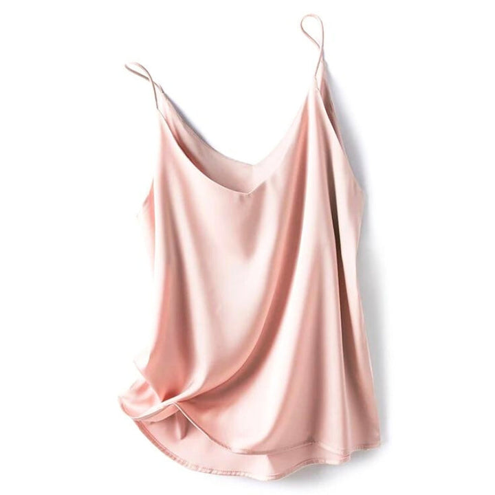 Women's pink silky camisole top displayed flat