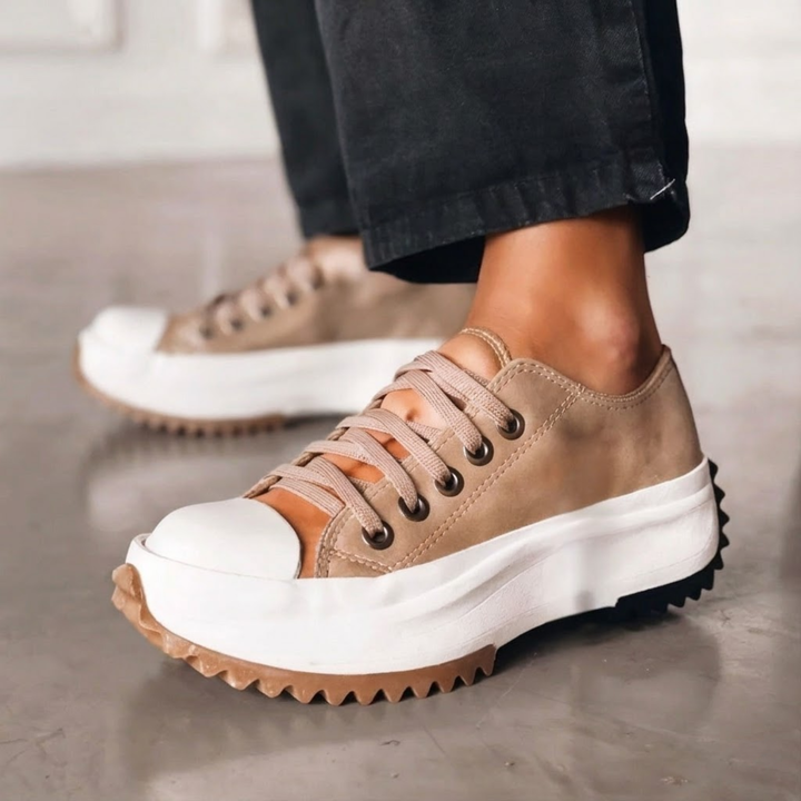 Women's brown platform sneakers featuring lace-up design and thick soles