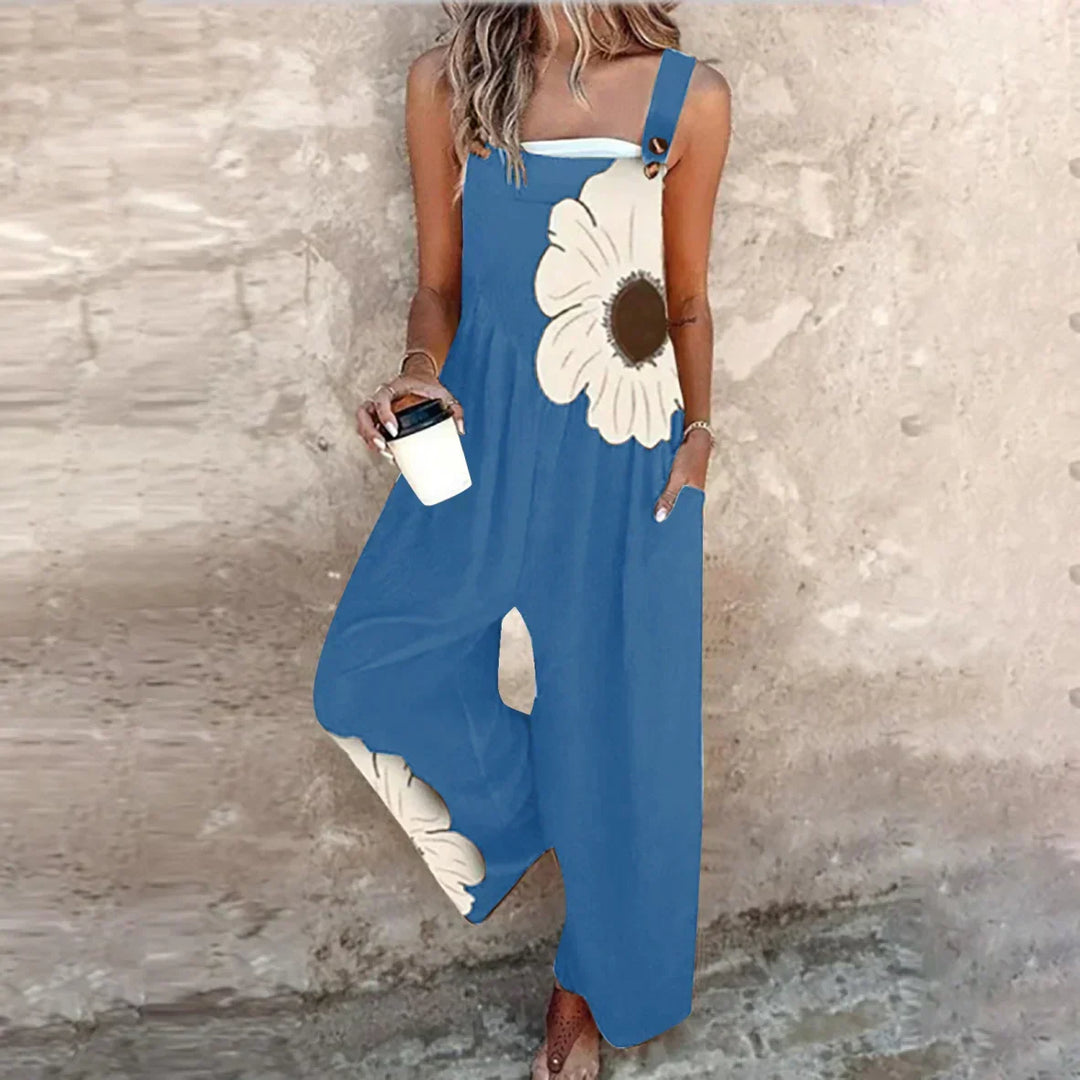 Woman showcasing a blue bohemian floral pattern wide-leg overall jumpsuit