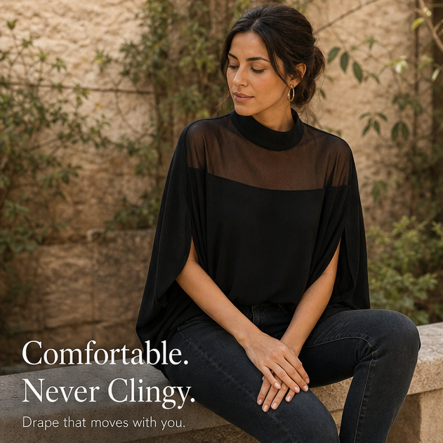 Flat lay of women's chic polka dot blouse with sheer mesh accents