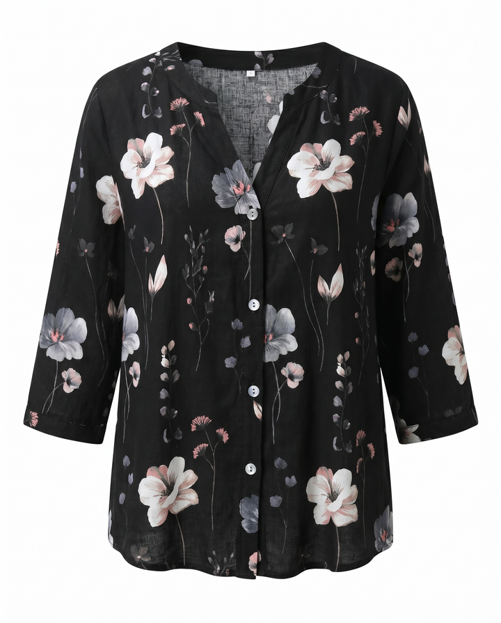 Flat lay of women's floral print V-neck blouse with 3/4 sleeves