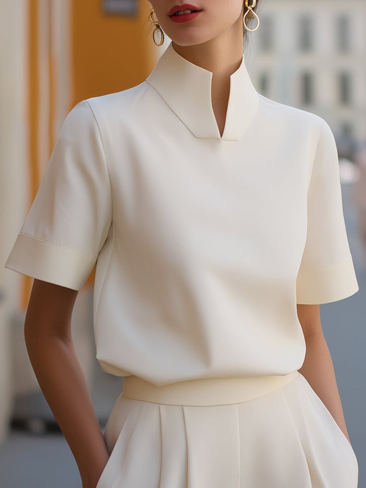 Woman wearing white elegant business blouse with stand-up collar