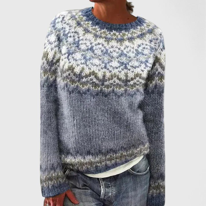 Woman wearing an ocean blue patterned knit pullover sweater