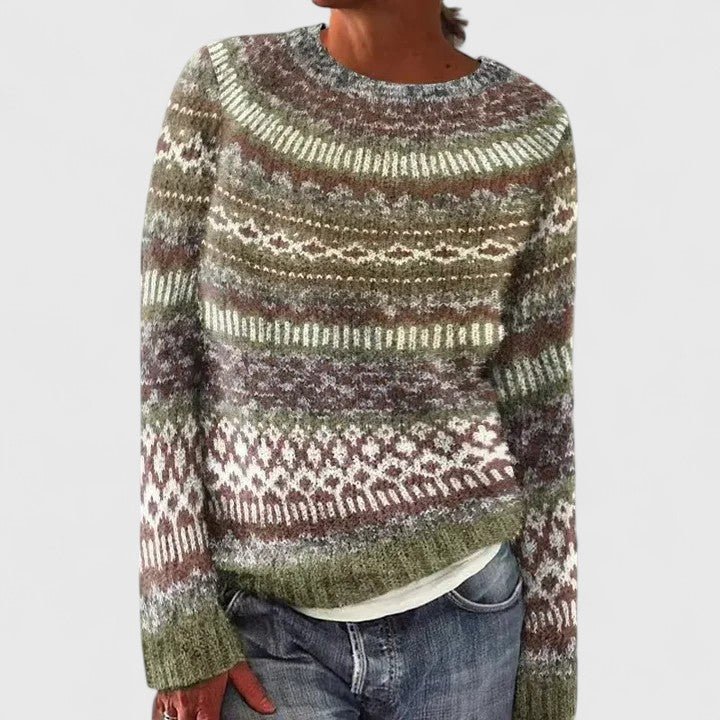Woman wearing a green patterned knit pullover sweater