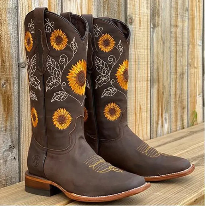 Dark brown women's cowboy boots with detailed sunflower embroidery and square toe