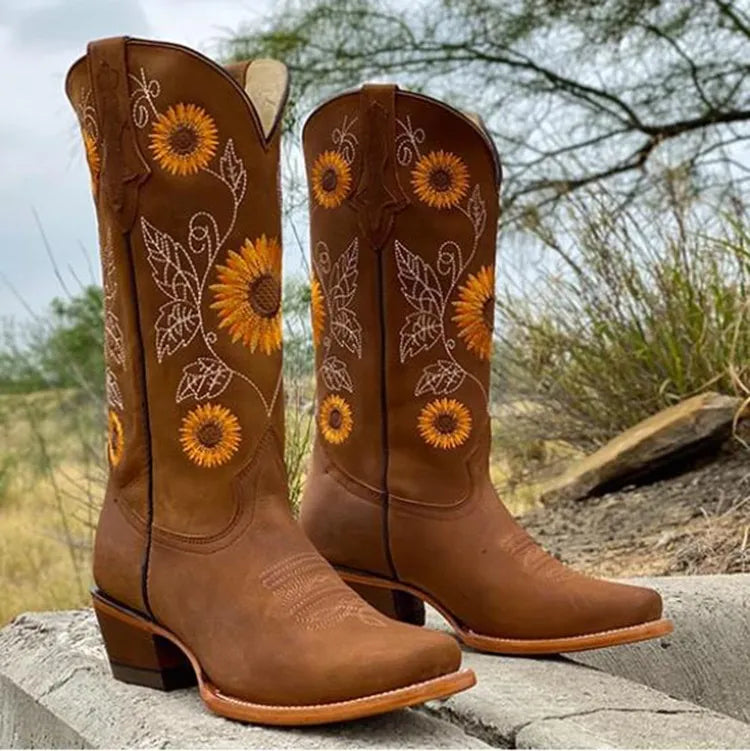 Brown women's western cowboy boots featuring floral stitching and block heel
