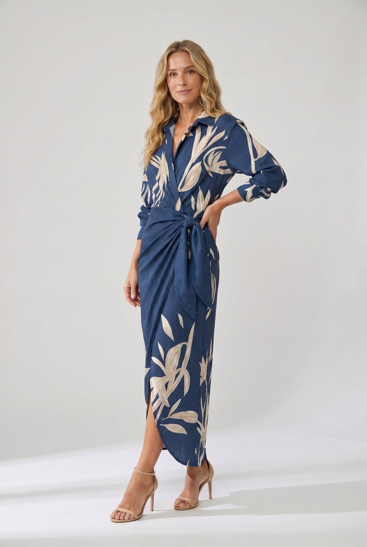 Studio shot of a blonde model posing in a long-sleeve botanical midi dress