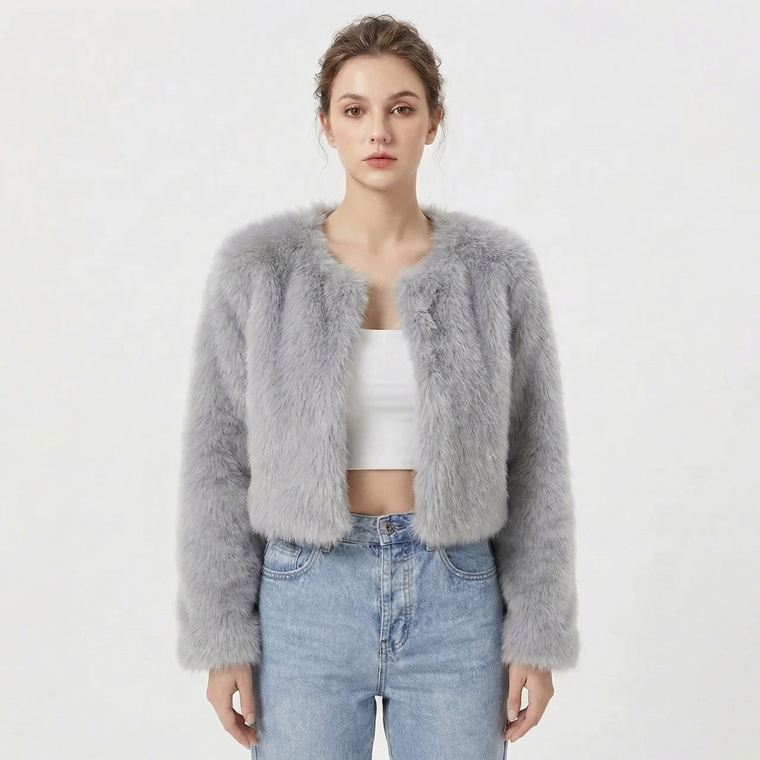 Model wearing light grey cropped fluffy jacket