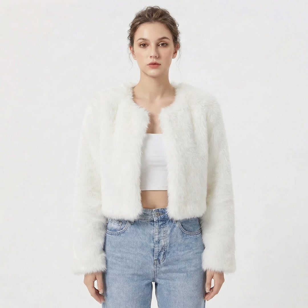 Model wearing white cropped fluffy jacket with open front design