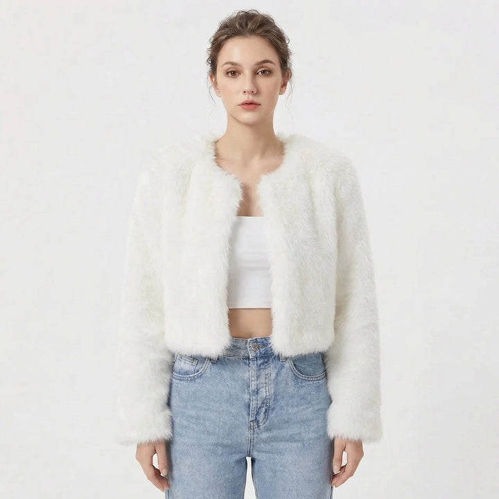 Model wearing white cropped fluffy jacket with open front design