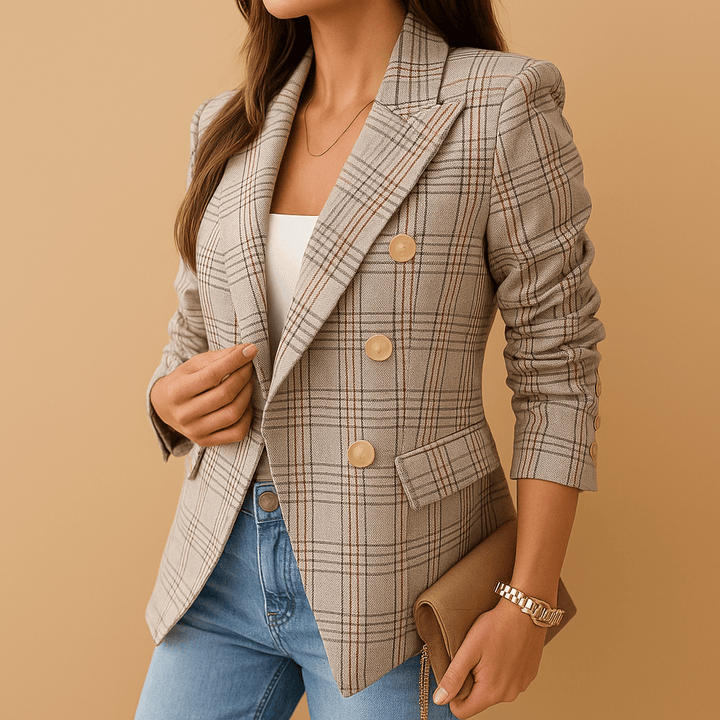 Woman wearing a gray-red plaid blazer with jeans and a handbag