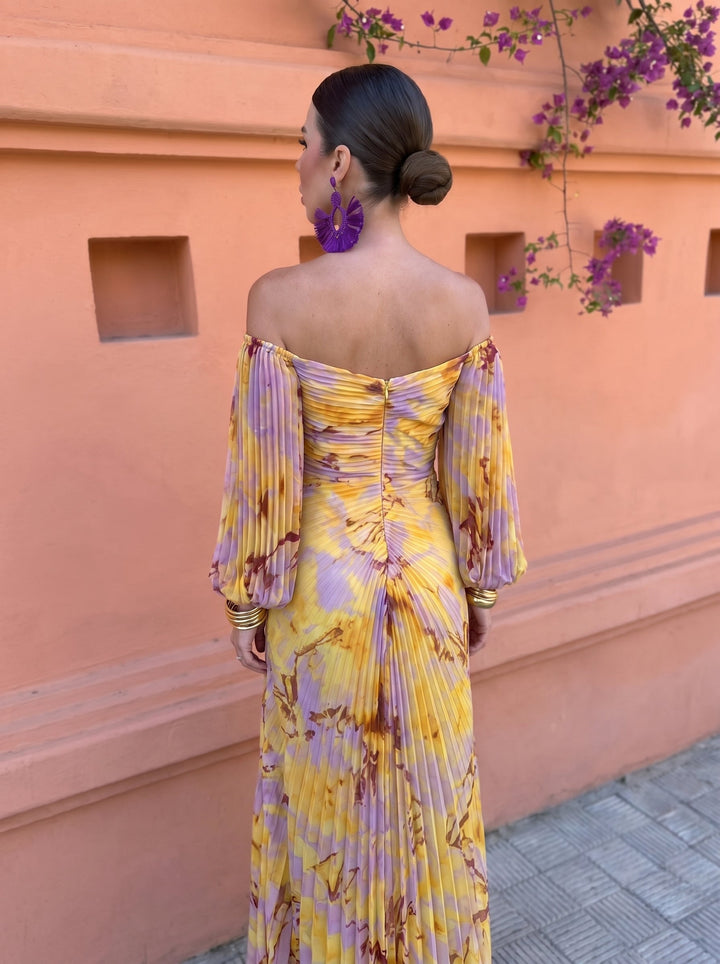 Back view of the yellow floral maxi dress showcasing the flowing silhouette