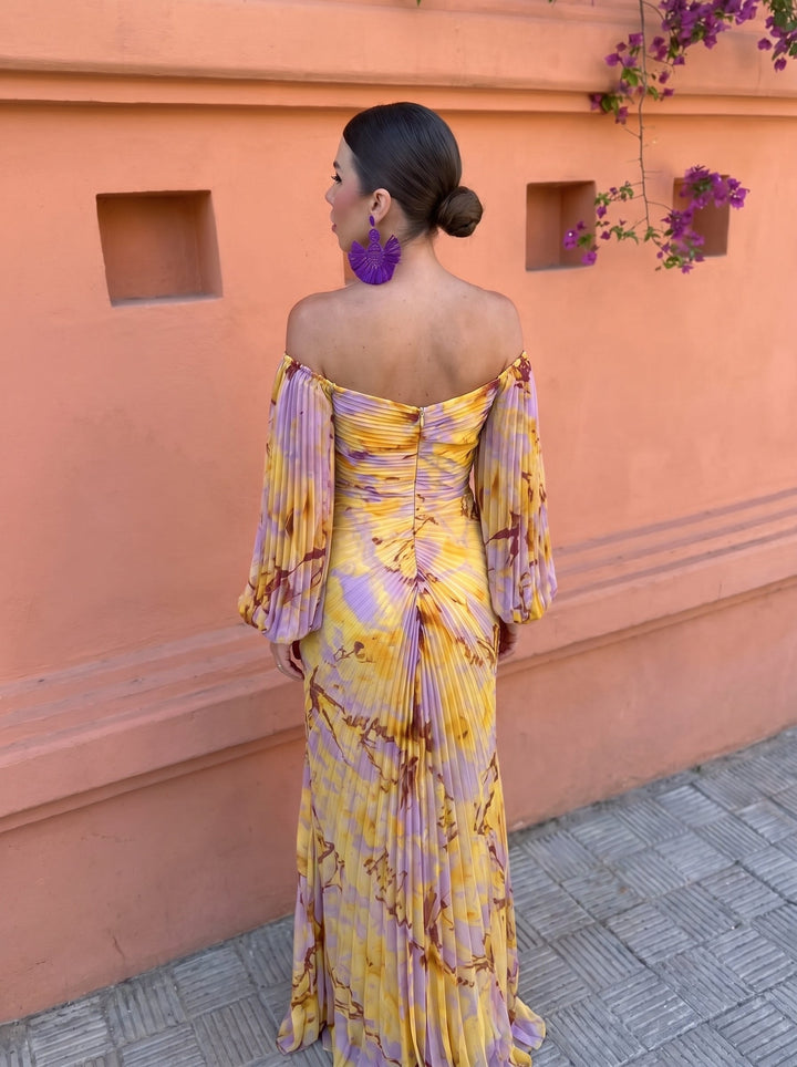 Yellow floral maxi dress with a pleated skirt for women, ideal for parties and special occasions.