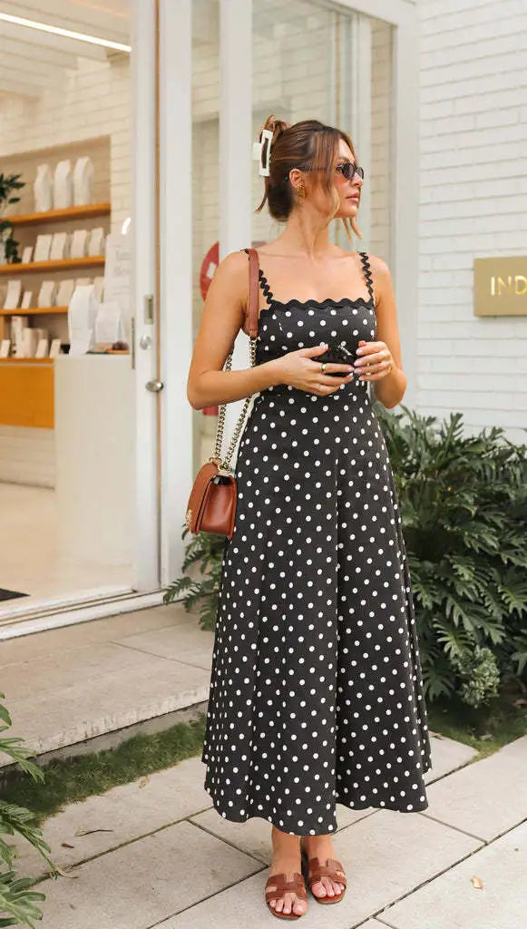 Full length view of black polka dot midi sundress and accessories