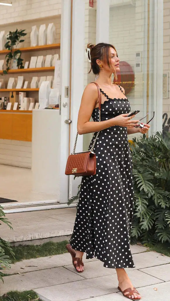 Close up view of polka dot midi dress fabric and summer sundress design details