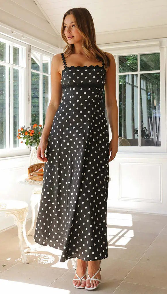 Back view of womens party dress featuring midi length polka dot pattern