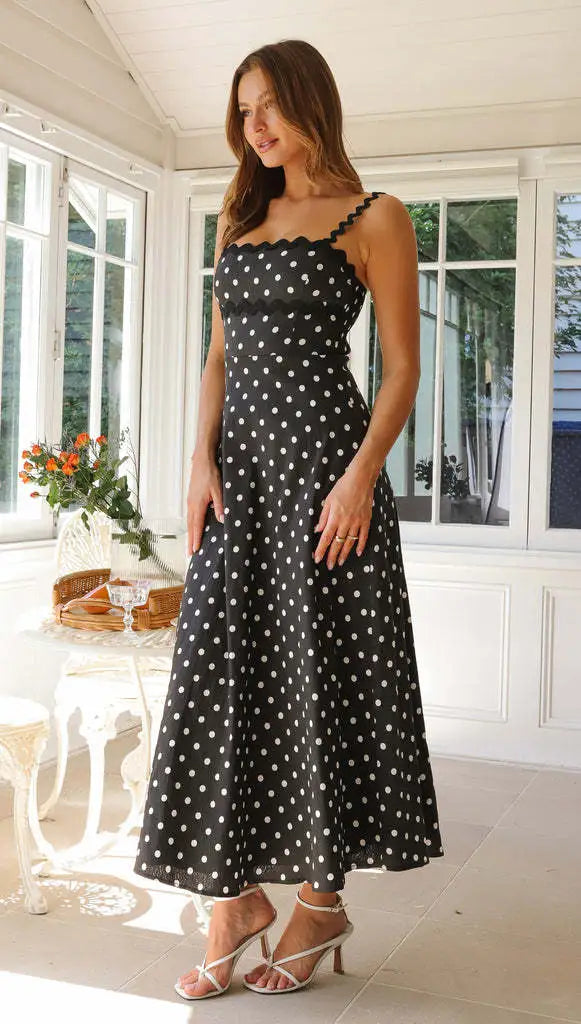 Full length shot of summer sundress in midi style with classic polka dots