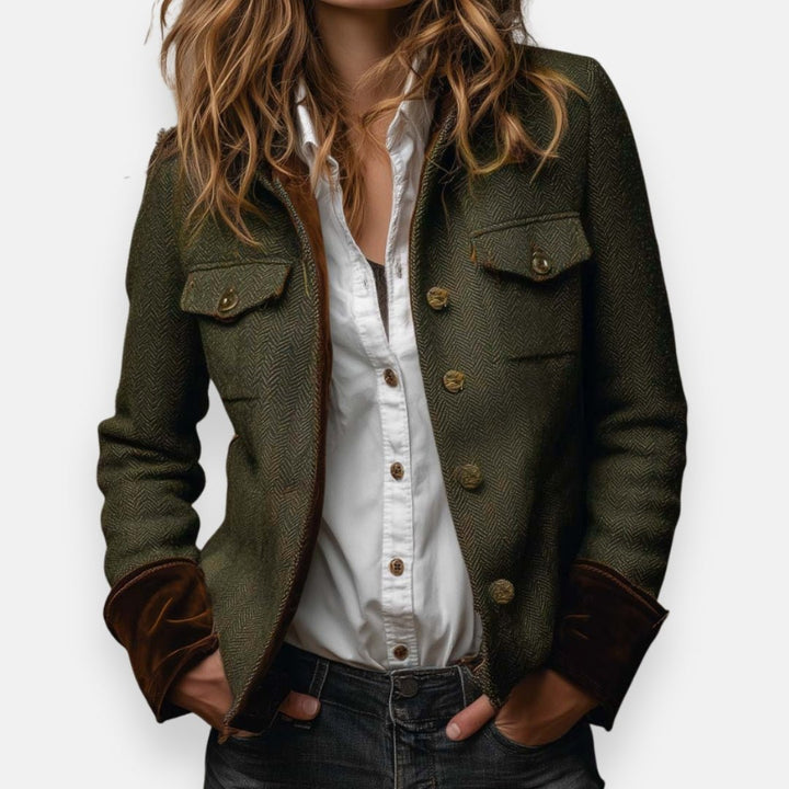 Woman wearing a brown herringbone blazer with button fastening and white shirt