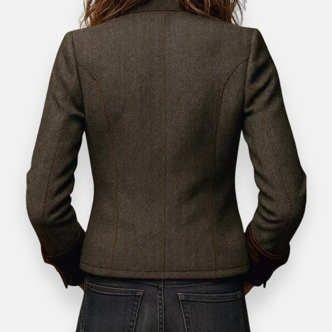 Back view of a women's brown tailored herringbone blazer showing fitted silhouette and vent.