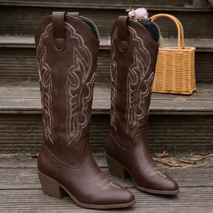 Beige embroidered knee-high boots with traditional cowboy boot styling