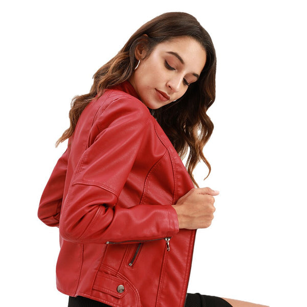 Woman wearing a red mandarin collar jacket posing sideways