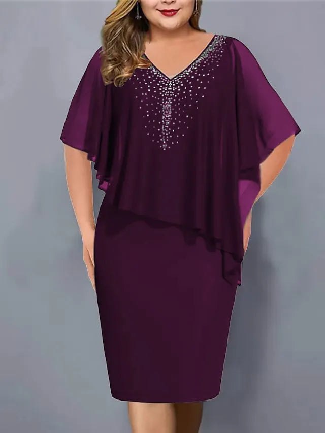 Close-up view of the V-neckline and flowing chiffon cape overlay on a stylish cocktail midi dress
