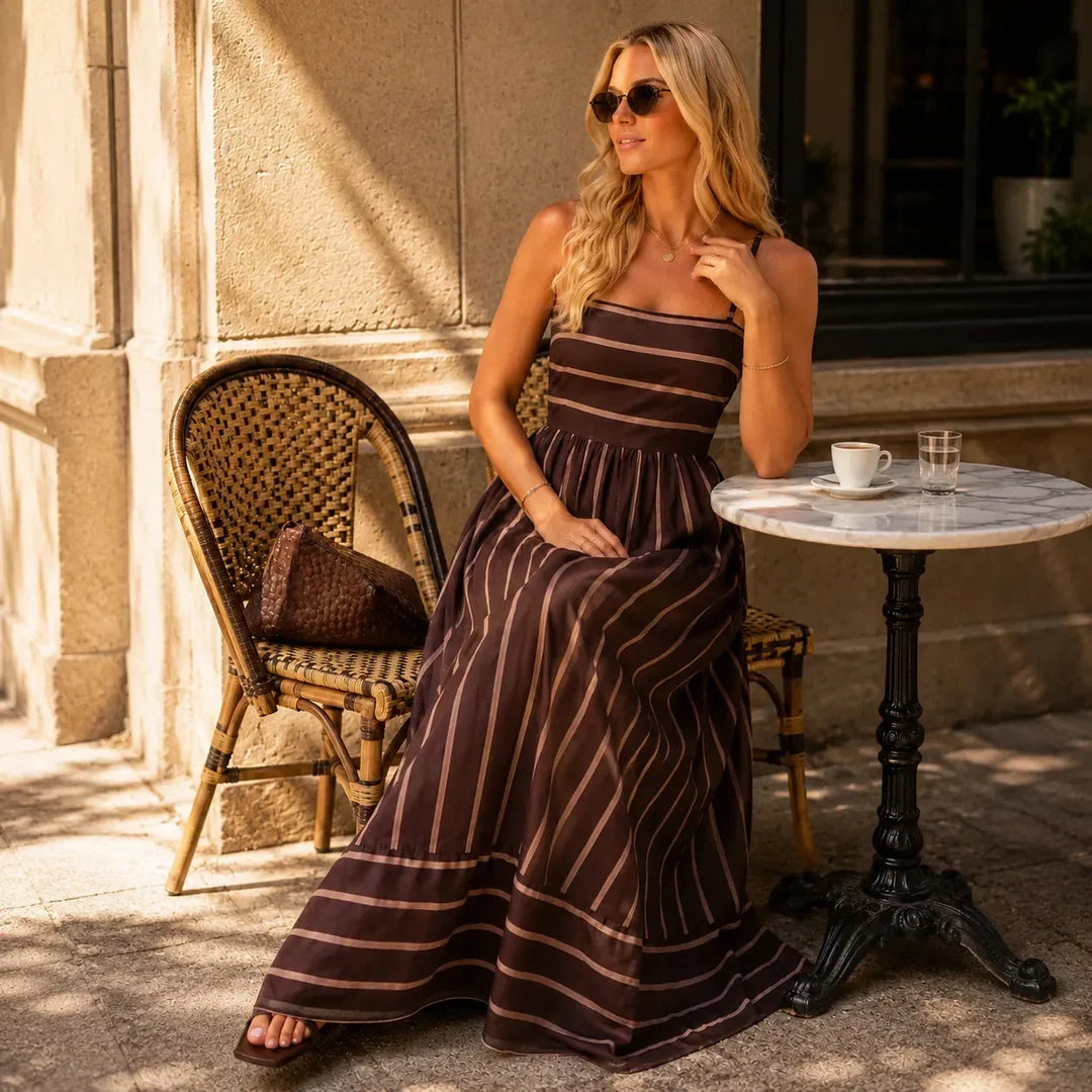 Full length view of striped summer dress styled for vacation