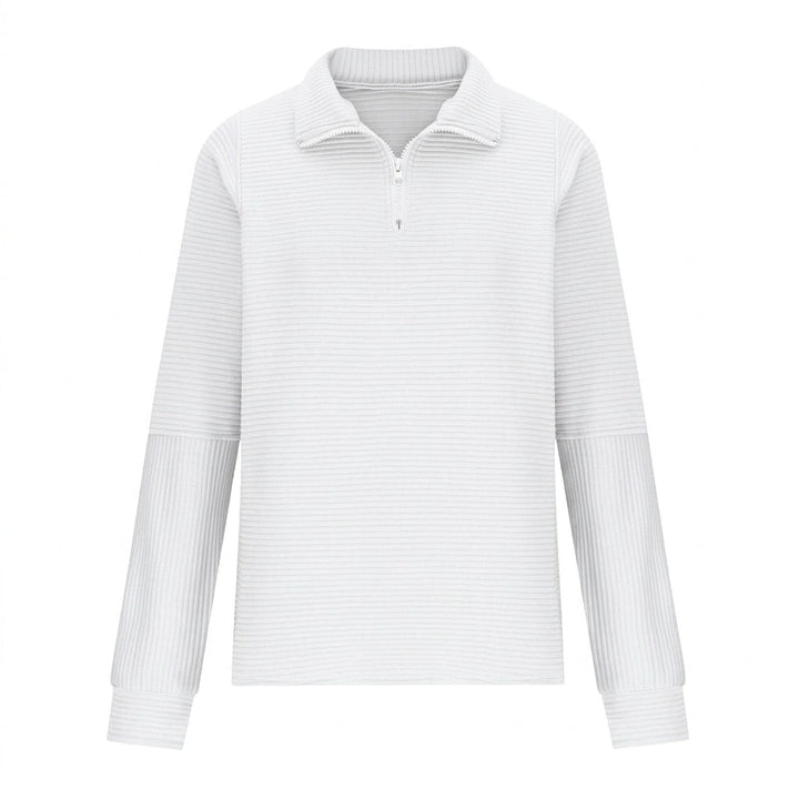 Close-up of the metal zipper and high funnel neck on a relaxed fit sweater