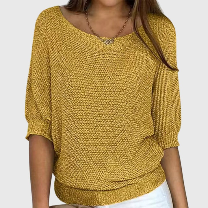 Long sleeve women's sweater featuring a cozy knit design for fall fashion trends