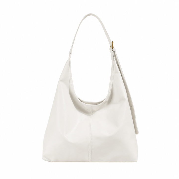 White women's slouchy single-strap shoulder tote bag isolated on white background