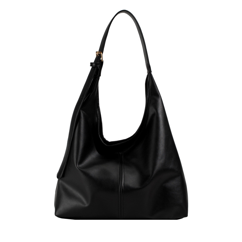 Slouchy shoulder tote bag showing spacious interior for laptop and daily essentials
