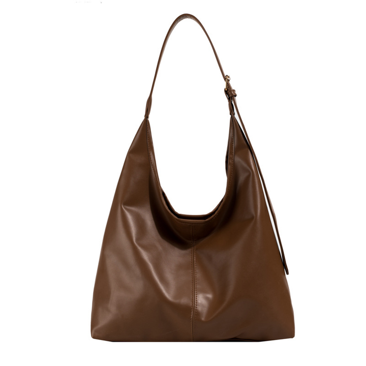 Close-up of the single strap and soft vegan leather texture on the large everyday bag