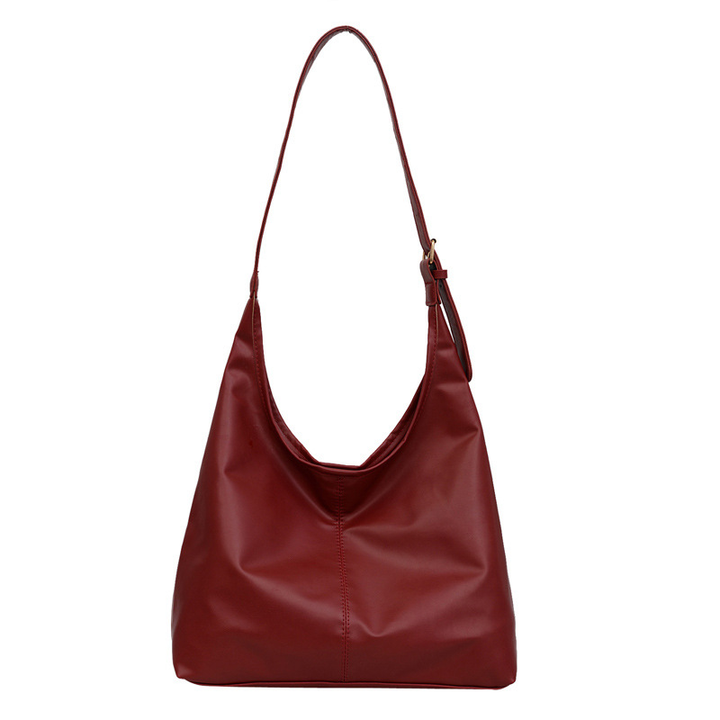 Womens casual work bag worn over the shoulder highlighting its relaxed slouchy shape