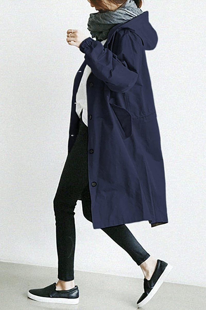 Womens casual raincoat and travel jacket featuring secure zipper pockets and adjustable hood.