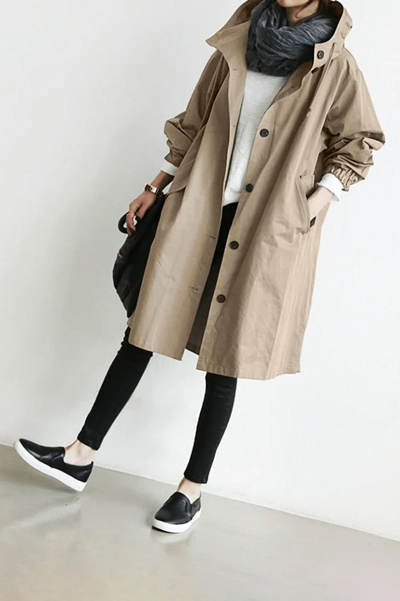 Side profile of womens all weather jacket demonstrating comfortable fit and stylish cut.