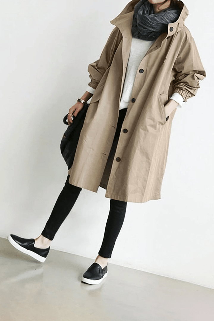 Side profile of womens all weather jacket demonstrating comfortable fit and stylish cut.