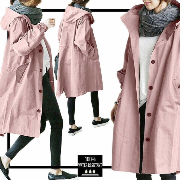 Woman wearing the pink Aurora windbreaker jacket with button closure