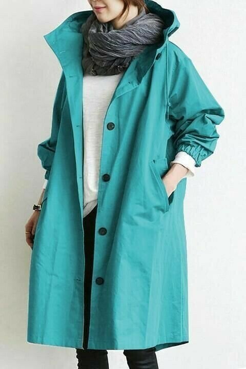 Womens outerwear windbreaker jacket folded neatly to highlight packable travel design.