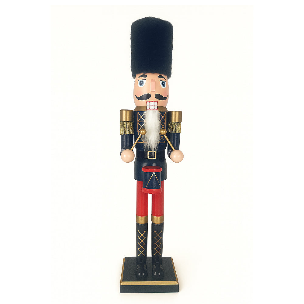Wooden nutcracker figure in dark blue uniform holding drumsticks