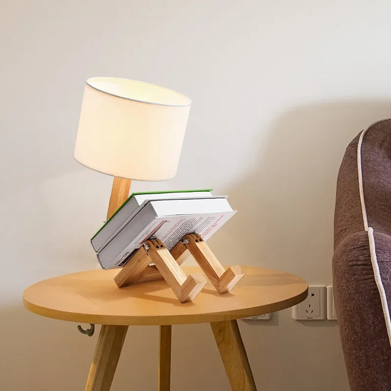 Wooden desk lamp with integrated book holder displaying an open book