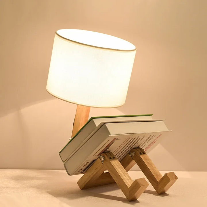 Flexible wooden table lamp showcasing its unique robot shape and grain