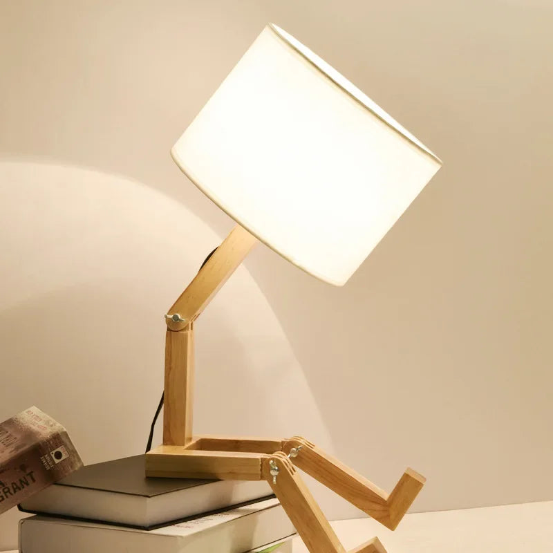 Modern bedside lighting setup featuring the adjustable wooden robot lamp