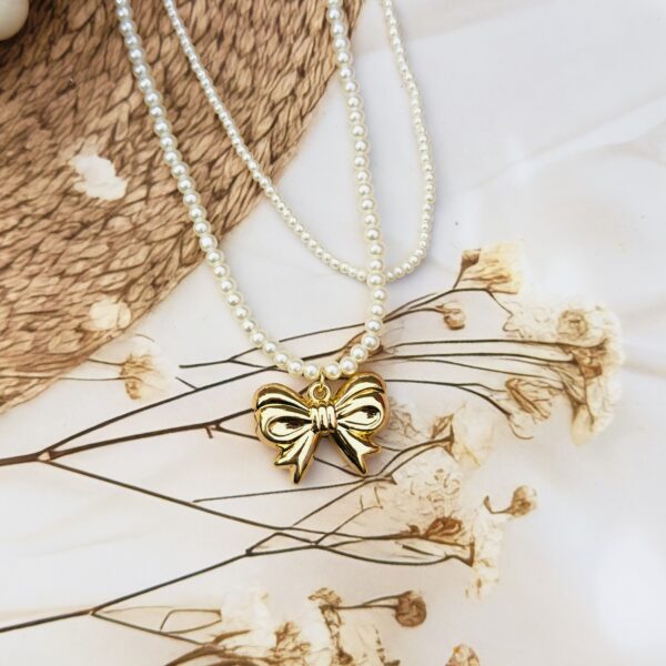 Double layered pearl neckline with a bow - Image 5